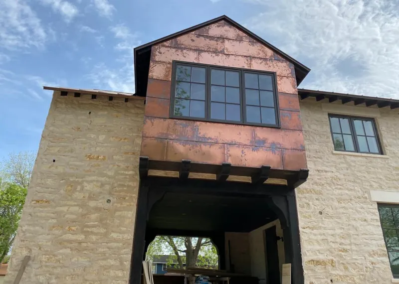 Copper metal panel facade on a stone building for Metal Roof Coating in O'Fallon