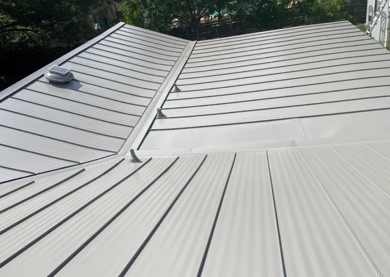 Solar attic fan installed on a metal roof for Roof Ventilation in O'Fallon